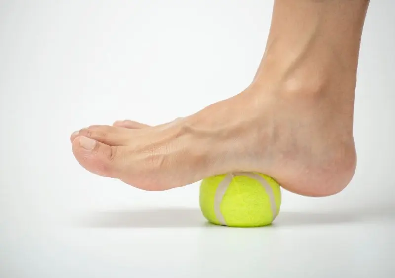 Rolling a tennis ball under the arch helps reduce tension